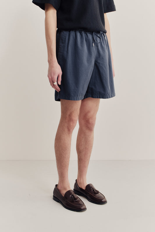 Men's shorts, cotton-linen blend, garment-dyed navy, with adjustable drawstring waist and side pockets.