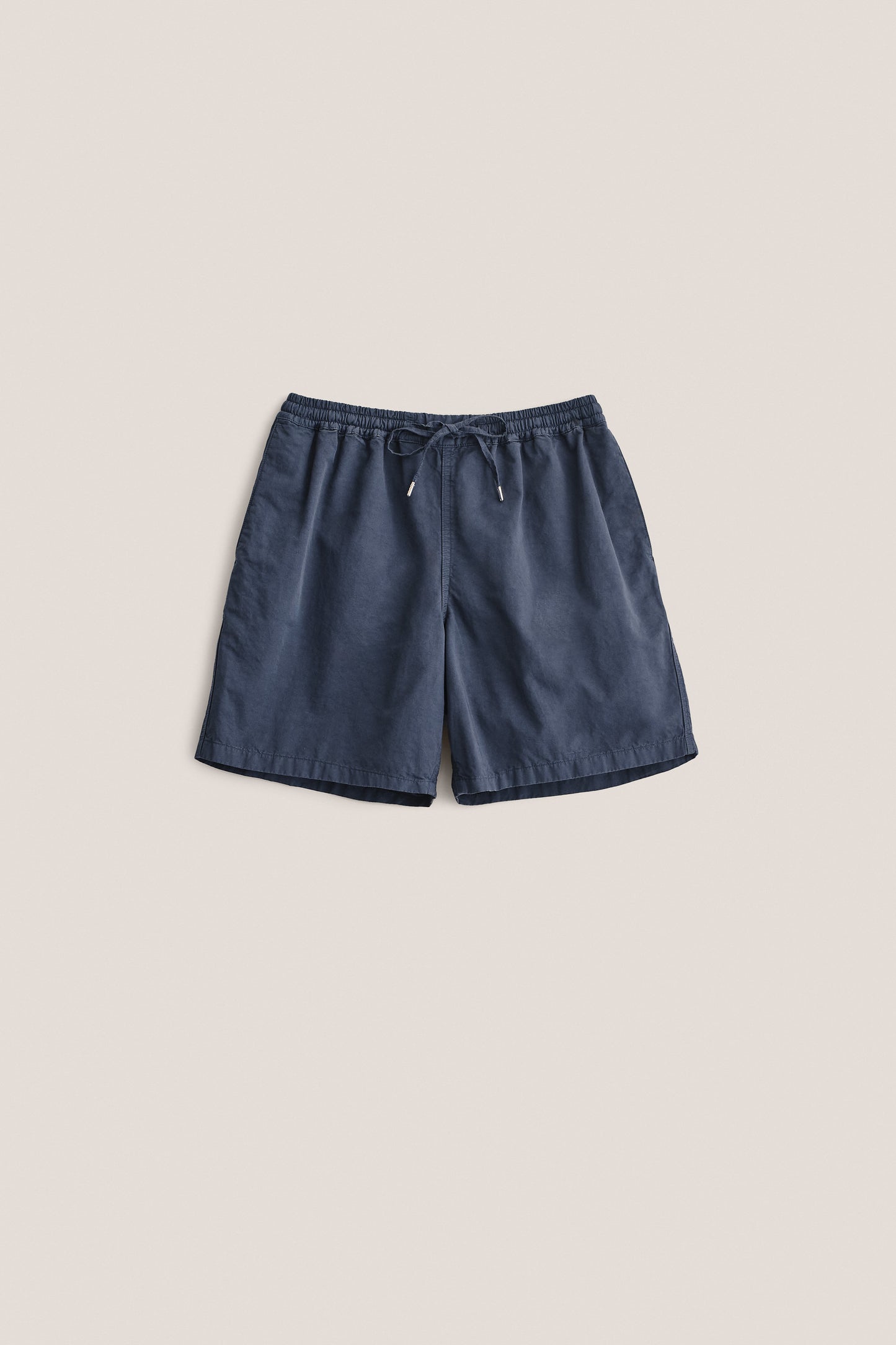 Men's shorts, cotton-linen blend, garment dyed navy, with adjustable waistband and pull cords.