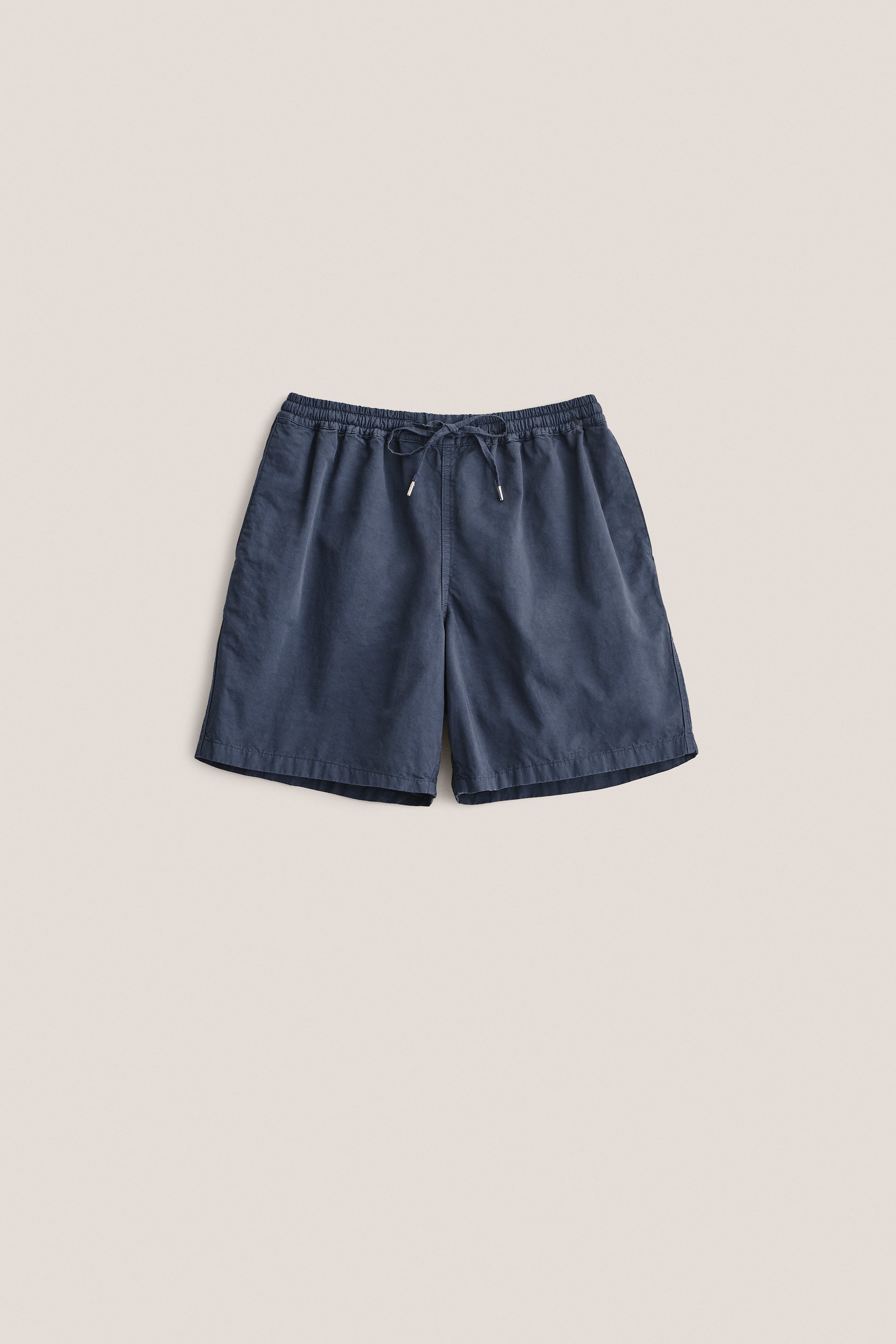 Men's shorts, cotton-linen blend, garment dyed navy, with adjustable waistband and pull cords.