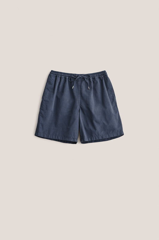 Men's shorts, cotton-linen blend, garment dyed navy, with adjustable waistband and pull cords.