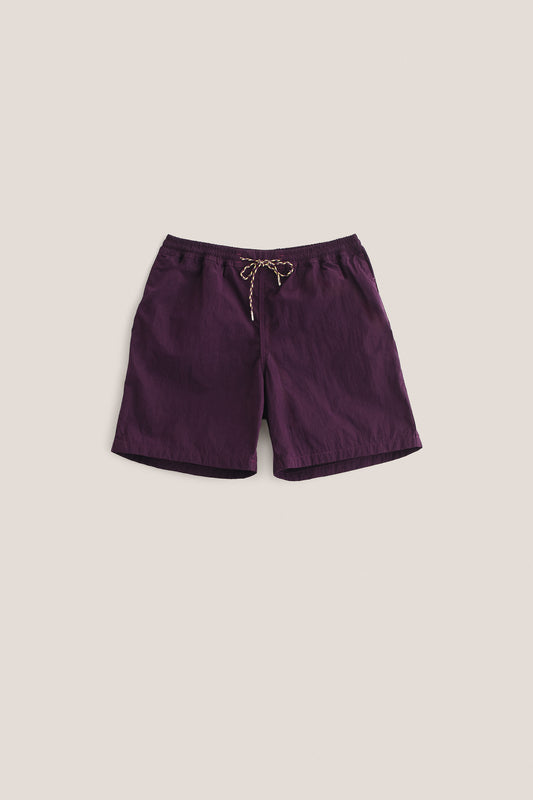Men's shorts, recycled polyamide, garment-dyed purple, with an adjustable drawstring waistband.