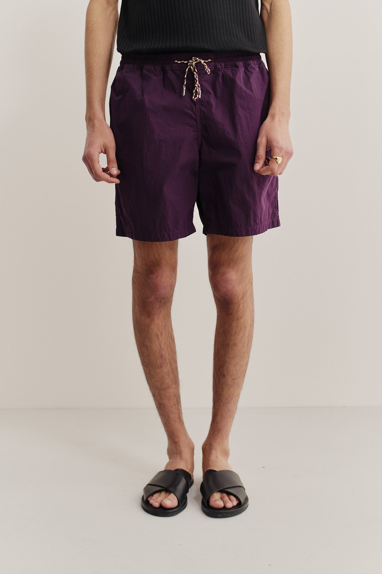 Men's shorts, recycled polyamide, garment-dyed purple, with adjustable drawstring waist.