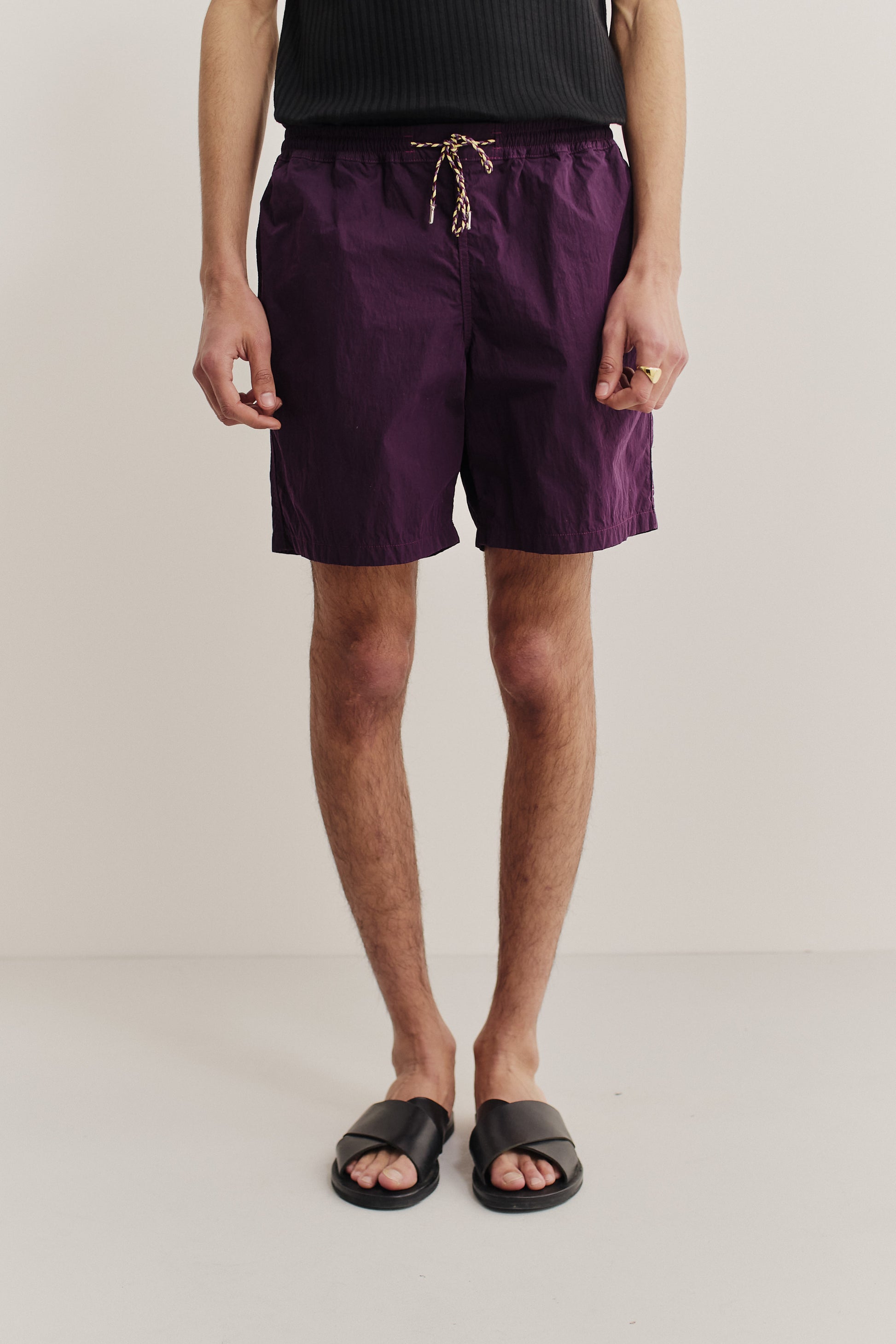 Men's shorts, recycled polyamide, garment-dyed purple, with adjustable drawstring waist.