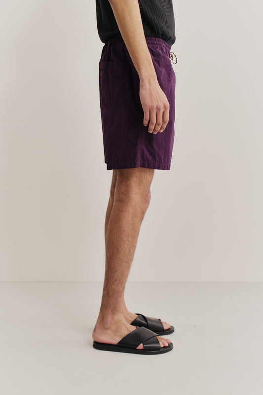 Men's shorts, recycled polyamide, garment-dyed purple, with side pockets and adjustable waistband.