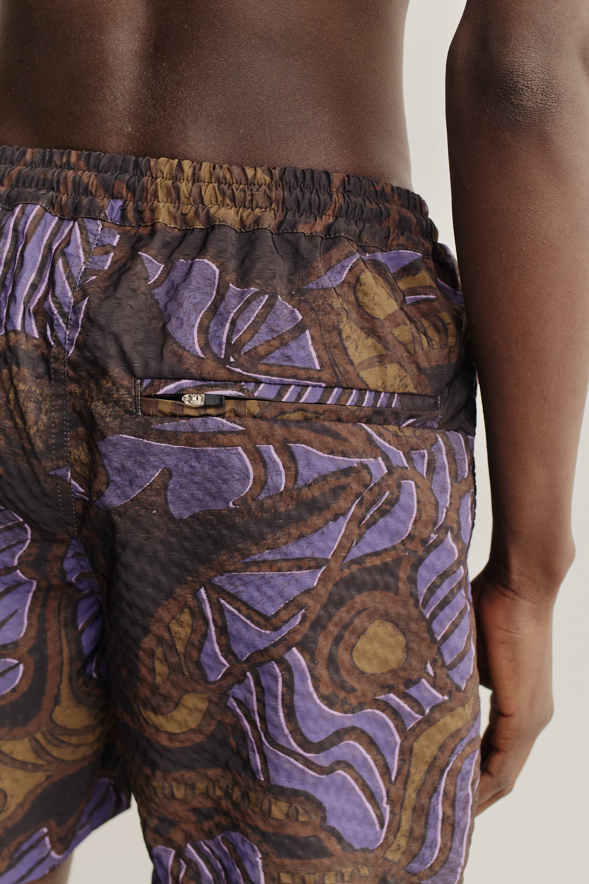 Men's shorts, seersucker recycled polyester, savage wildlife print, elastic waist, back zip pocket.