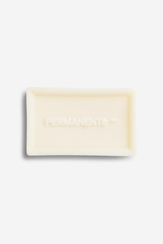 Women's accessories, soap bar, organic, off-white, with "PERMANENTS" embossed.