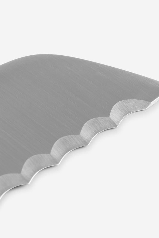Silver hand-forged chrome steel bread knife blade with unique scalloped serrations.
