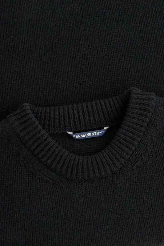 Men's knit pullover, black merino wool-cashmere blend, with ribbed crew neck and hem.
