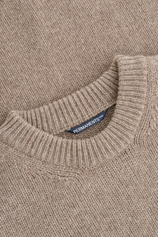 Men's knit pullover, taupe melange merino wool-cashmere blend, with ribbed neck and "PERMANENTS" label.