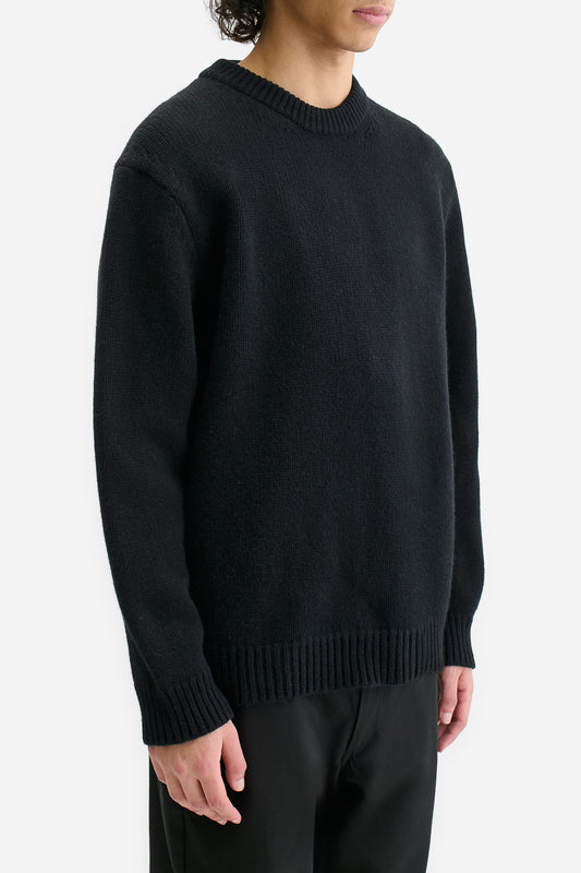 Men's knit pullover, black wool-cashmere blend, relaxed fit with rib-knit details.