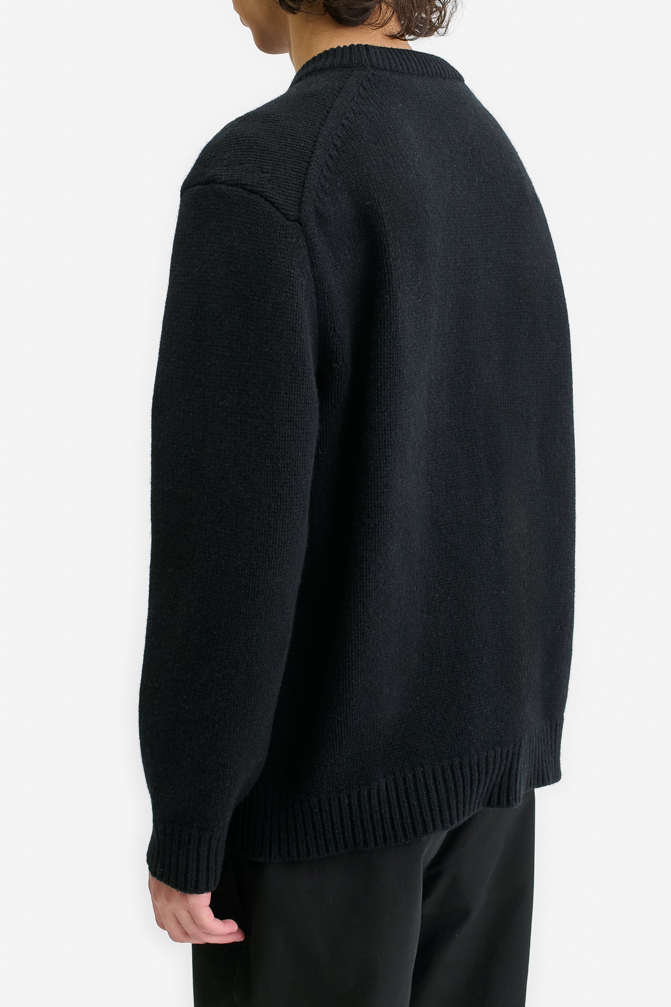 Men's knit pullover, black wool-cashmere blend, relaxed fit, rib-knit details.