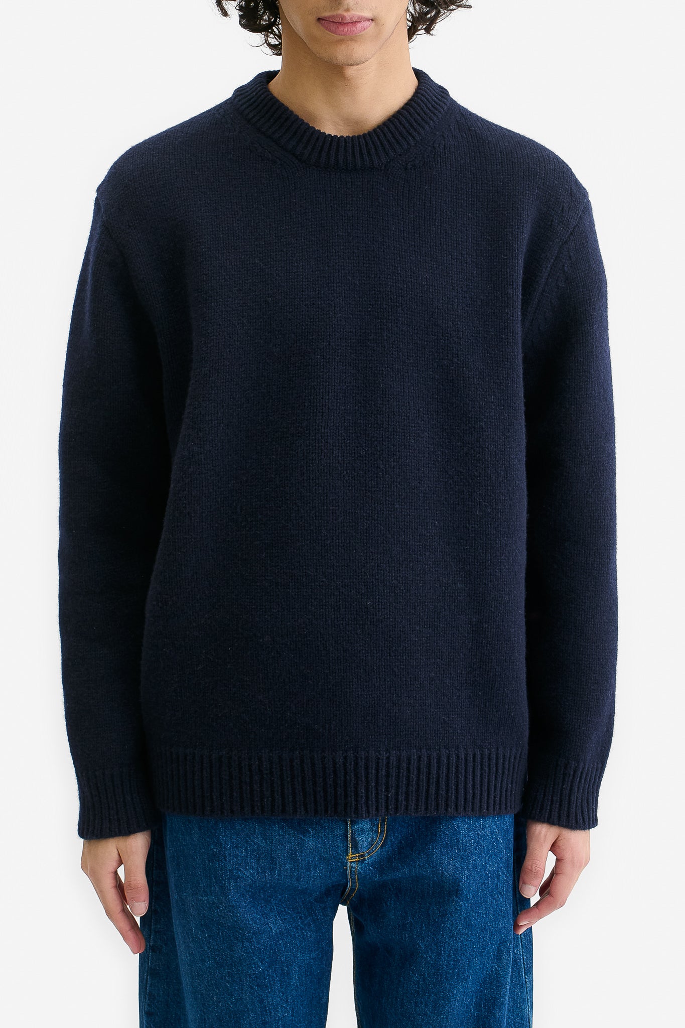 Men's knit pullover, wool-cashmere blend, navy, relaxed fit with ribbed neck, cuffs, and hem.
