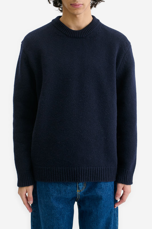 Men's knit pullover, wool-cashmere blend, navy, relaxed fit with ribbed neck, cuffs, and hem.