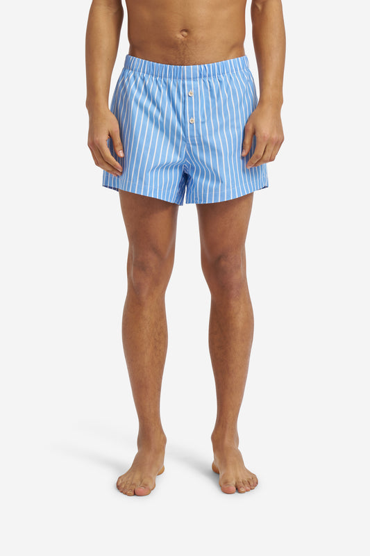 Men's jersey shorts, 100% organic cotton, light blue with white vertical stripes, button fly.