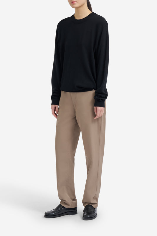 Women's knit crewneck, black mulesing-free merino wool, with rib-knit details.