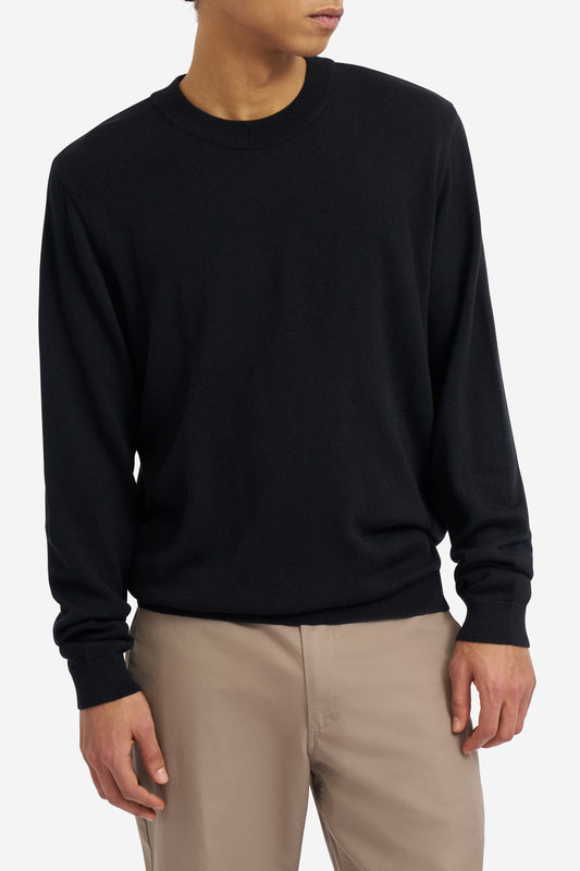 Men's knit crewneck, 100% mulesing-free merino wool, black, with rib-knit neck, cuffs, and hem.