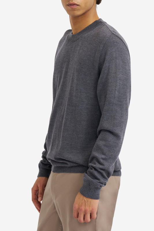 Men's knit crewneck, dark-grey mulesing-free merino wool, with rib-knit neck, cuffs, and hem.
