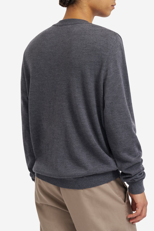 Men's knit crewneck, 100% mulesing-free merino wool, dark-grey, with rib-knit neck, cuffs, and hem.