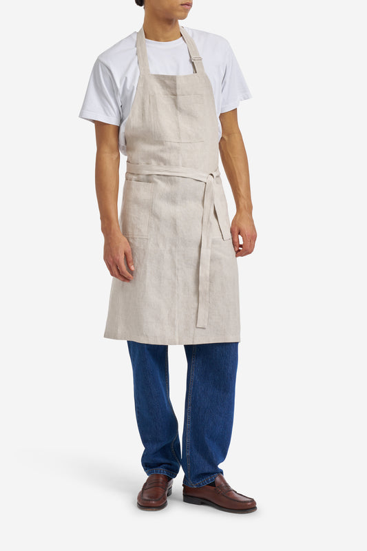 Men's accessories apron, 100% Belgian linen, flax color, with three patch pockets and adjustable neck strap.