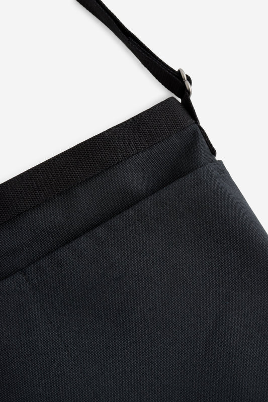 Unisex accessories crossbody bag, recycled Ventile® cotton, water-repellent, black, with adjustable strap and front pockets.