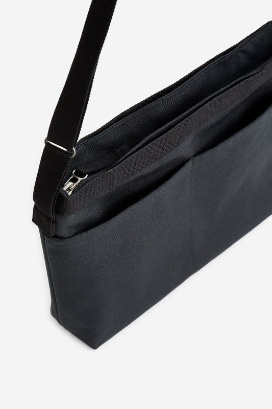 Unisex accessories crossbody bag, recycled cotton, water-repellent, black. Compact design with multiple pockets and zipper.