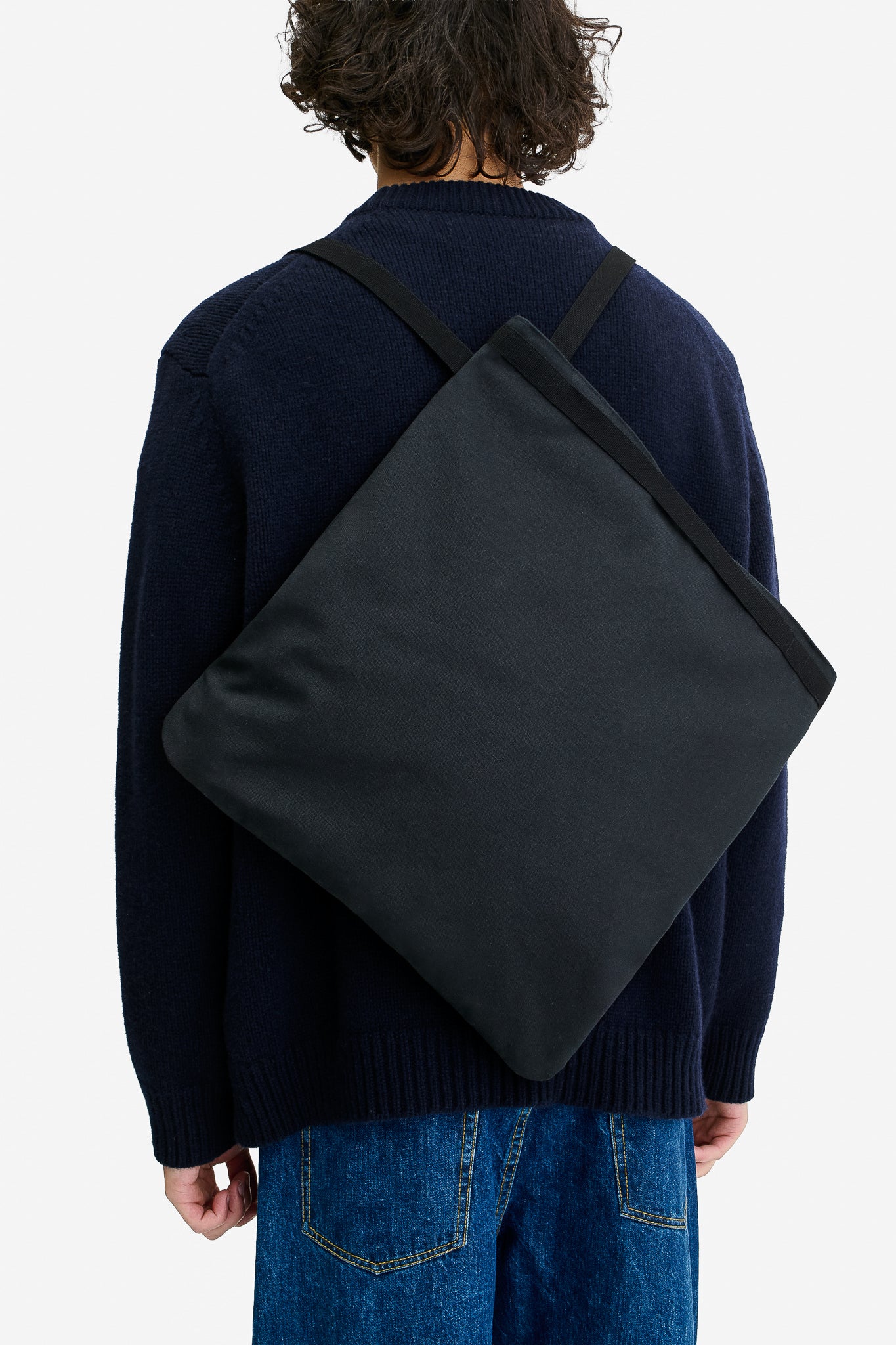 Men's accessories, 3-Way Tote, recycled Ventile® cotton, water-repellent, black, worn as a backpack.